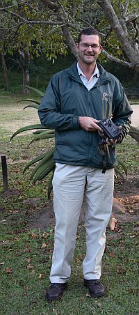 Johann Vermeulen with a camera trap